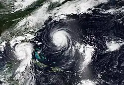 Two hurricanes on the right, Eleven and Gert on the left
