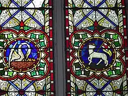 Pelican vulning and Lamb of God with flag with Triumphal cross, both symbols of the Resurrection (stained glass, Ireland, 19th century)