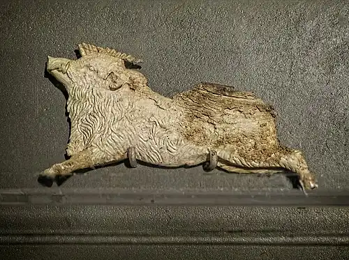 Ivory plaque depicting a boar from the footrest of the funeral couch