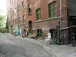 street scene with brick multi-story building