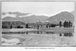 Early photograph of Jokhang behind a small body of water