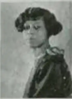 A young Black woman with hair cut in a bob with a side part