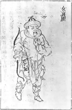 Black-and-white print of a severe-looking man with long rising eyebrows and a mustache, wearing skin shoes, a round-edged fur cap, and clothing with several folds held together by a sash and surmounted by a fur collar. He is holding a bow in his right hand. Three Chinese characters that read "Nüzhen tu" ("image of a Jurchen") appear on the upper right corner.