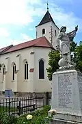 The Szent Kereszt-templom (English: Holy Cross Church) with the monument for those who died in the Second World War or in the Revolution of 1956