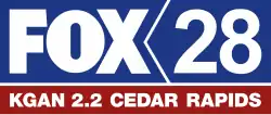 In a blue box with a chevron-shaped divider, from left: the Fox network logo and a blue 28. Beneath in white text on a red box: "K G A N 2.2 Cedar Rapids".