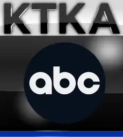 In a glossy white box, the black letters K T K A. Beneath it, in a glossy black box, the ABC logo. A blue underline sits at the bottom.