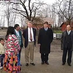 United States ambassador Thomas B. Robertson visiting the Romani settlement of Kerinov Grm (2005)