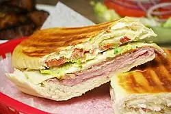 Image 3A Cuban sandwich is a variation of a ham and cheese sandwich that originated among the Cuban workers in the cigar factories in Key West, Florida[1][2]