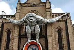 An inflatable gibbon sculpture by Roet, mounted on the King's Hall, Edinburgh as part of the 2023 Edinburgh Festival Fringe.