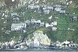Ugiuvak, abandoned Inupiat stilt village, in 2010. The large white building near the bottom of the slope is the former Bureau of Indian Affairs school.