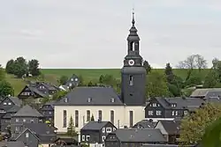 Church and houses, slate-faced.