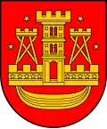 A coat of arms depicting a golden castle with three turrets surrounded with four golden stars all on a red background