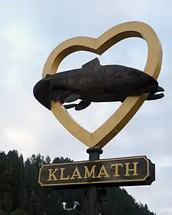 A giant salmon in a heart sign at the entrance to the town of Klamath