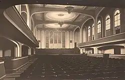 black-and-white photograph of the interior of a large empty concert hall