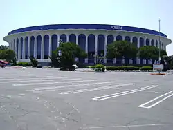 A concrete building with the words "Great Western Forum" on top situates across an empty parking lot