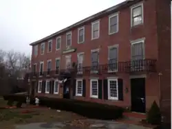 The Company Store, now known as the Larkin Building, on the edge of Linwood, at Whitin St. and East Hartford Ave. The Company Store is a part of the Rogerson Village Historic District.