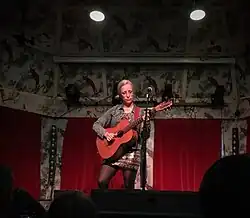 Veirs onstage playing guitar