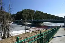 A bridge crosses an icy river