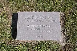 Small stele engraved with the name of the deceased.