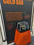 Liftable gold bar on display