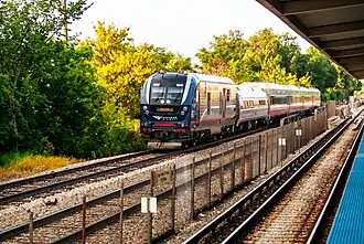 St. Louis-bound Lincoln Service train passes the CTA's 35th/Archer station in Chicago, Illinois