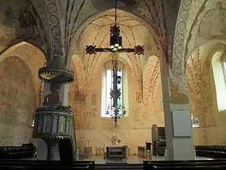Interior view of Lohja Church showing the vivid medieval paintings executed in 1510s.