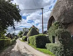 Thatched cottages at Longstock, Hampshire, England. September 2024.
