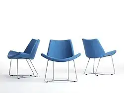 An upholstered lounge chair inspired by the Lotus position and part of the Danish Design Project at MoMa, New York, designed by Busk-Hertzog in 2003.