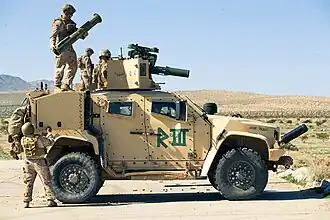 U.S. Marines loading a TOW missile on an M1281
