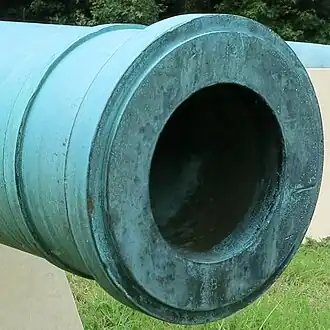 Closeup photo shows the muzzle of a M1844 32-pounder Howitzer at Petersburg.