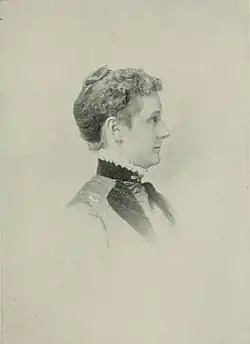 19th-century B&W side-view portrait of a woman with her hair in an up-do.