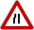 Road narrows on the left