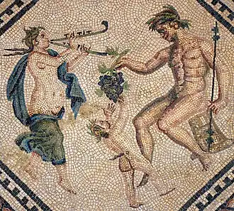 A tibia-playing maenad dancing with a satyr, part of the Dionysosmosaik, a mosaic in the Romano-Germanic Museum in Cologne, Germany.