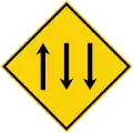 Three-lane carriageway ahead, with two lanes in the opposing direction.