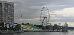 The Float at Marina Bay in 2007, with the Singapore Flyer under construction in the background.