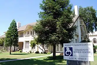 Front of house with large trees