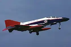 A jet aeroplane with undercarriage down.