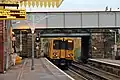 A Merseyrail Class 507 departs towards Liverpool.