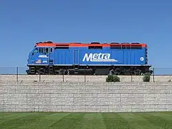 Blue locomotive on raised track