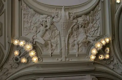 Stylized Art Nouveau cartouche with the RF monogram (which stands for Republique Française) on a ceiling of the Town Hall of Euville, France, by Henri Gutton, 1901-1909[17]