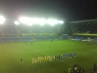 AFC Wimbledon and Millwall players met for the first time in the FA Cup at The Den in 2009.