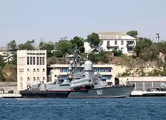 Grey military ship with missiles