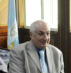 The flag behind former governor Mohammed Ezzat Agwa.