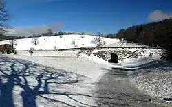 The MST crossing under a snowy Blue Ridge Parkway in Moses H. Cone Memorial Park.
