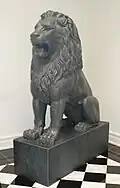 One of a pair of antique statuary lions at the entrance to the exhibits.