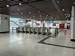 Fare gates at the concourse level of the station