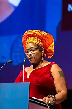 Nalo Hopkinson speaking at a podium