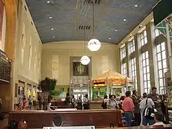Interior of main waiting room, featuring an information booth