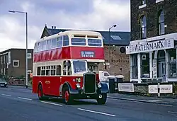 A red and cream double-deck bus