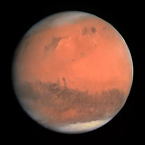Image 16 Mars Photograph credit: European Space Agency Mars is the fourth planet from the Sun and is known as the "Red Planet" due to its reddish appearance as seen from Earth. The planet is named after Mars, the Roman god of war. A terrestrial planet, Mars has a thin atmosphere and surface features reminiscent both of the impact craters of the Moon and the volcanoes, valleys, deserts and polar ice caps of the Earth. The planet has the highest mountain in the Solar System, Olympus Mons, as well as the largest canyon, Valles Marineris. Mars's rotation period and seasonal cycles are also similar to those of the Earth. Of all the planets in the Solar System other than Earth, Mars is the most likely to harbour liquid water and perhaps life. There are ongoing investigations assessing Mars's past potential for habitability, as well as the possibility of extant life. Future astrobiology missions are planned, including NASA's Mars 2020 rover and the European Space Agency (ESA)'s Rosalind Franklin rover. In November 2016, NASA reported finding a large amount of underground ice in the Utopia Planitia region of the planet. The volume of water detected has been estimated to be equivalent to the volume of water in Lake Superior. Mars has two moons, Phobos and Deimos, which are small and irregularly shaped. This picture is a true-colour image of Mars, taken from a distance of about 240,000 kilometres (150,000 mi) by the OSIRIS instrument on ESA's Rosetta spacecraft, during its February 2007 flyby of the planet. The image was generated using OSIRIS's orange (red), green and blue filters. More selected pictures